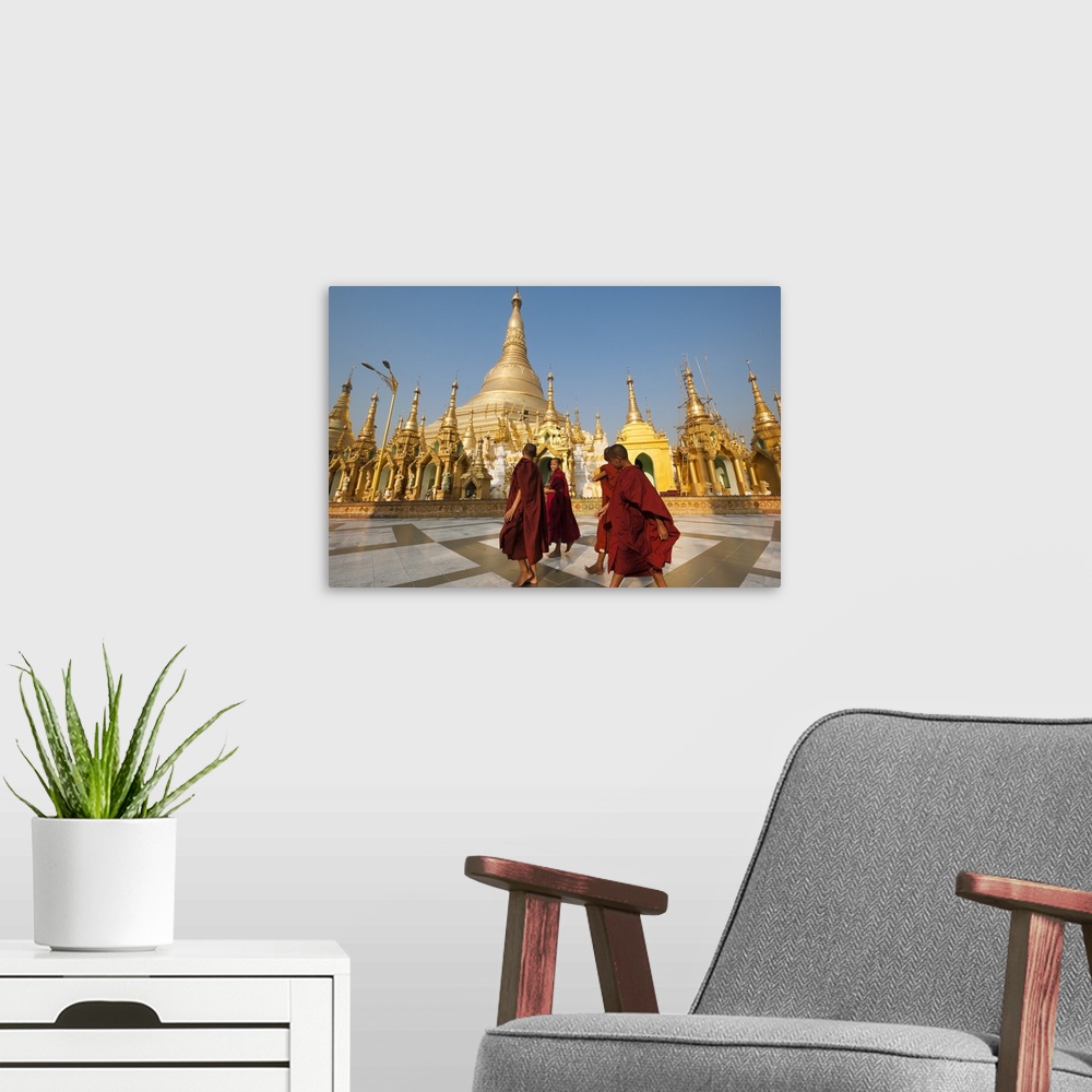 A modern room featuring Monks walk around Shwedagon Pagoda, Yangon, Myanmar