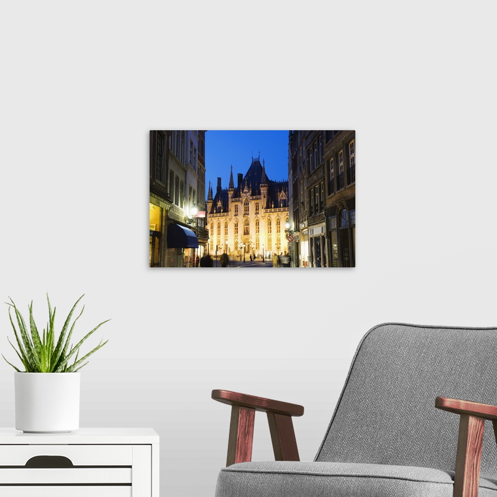 A modern room featuring Neo-gothic post office; Market square illuminated at night, Bruges, Flanders, Belgium