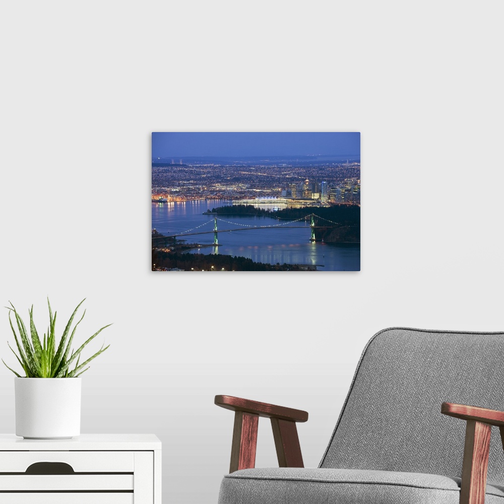 A modern room featuring Night view of city skyline and Lions Gate Bridge, Vancouver, Canada