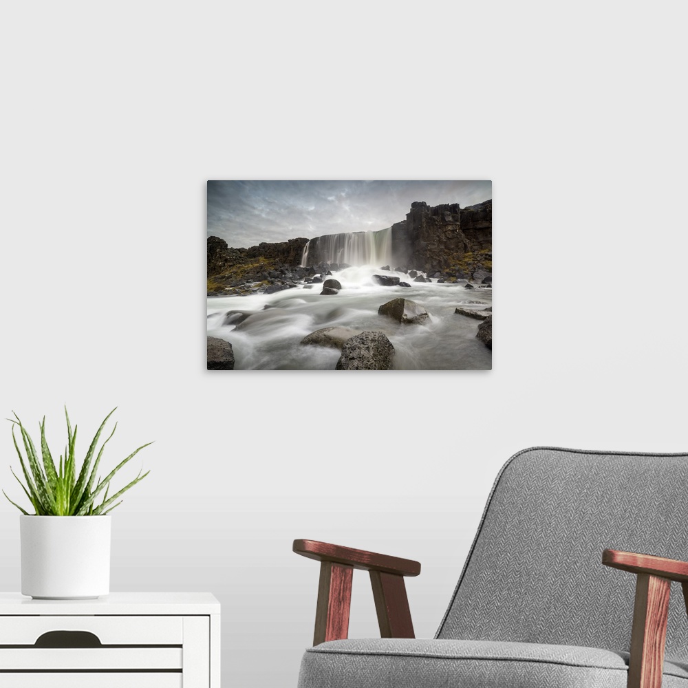 A modern room featuring Oxararfoss waterfall, Thingvellir National Park, Iceland