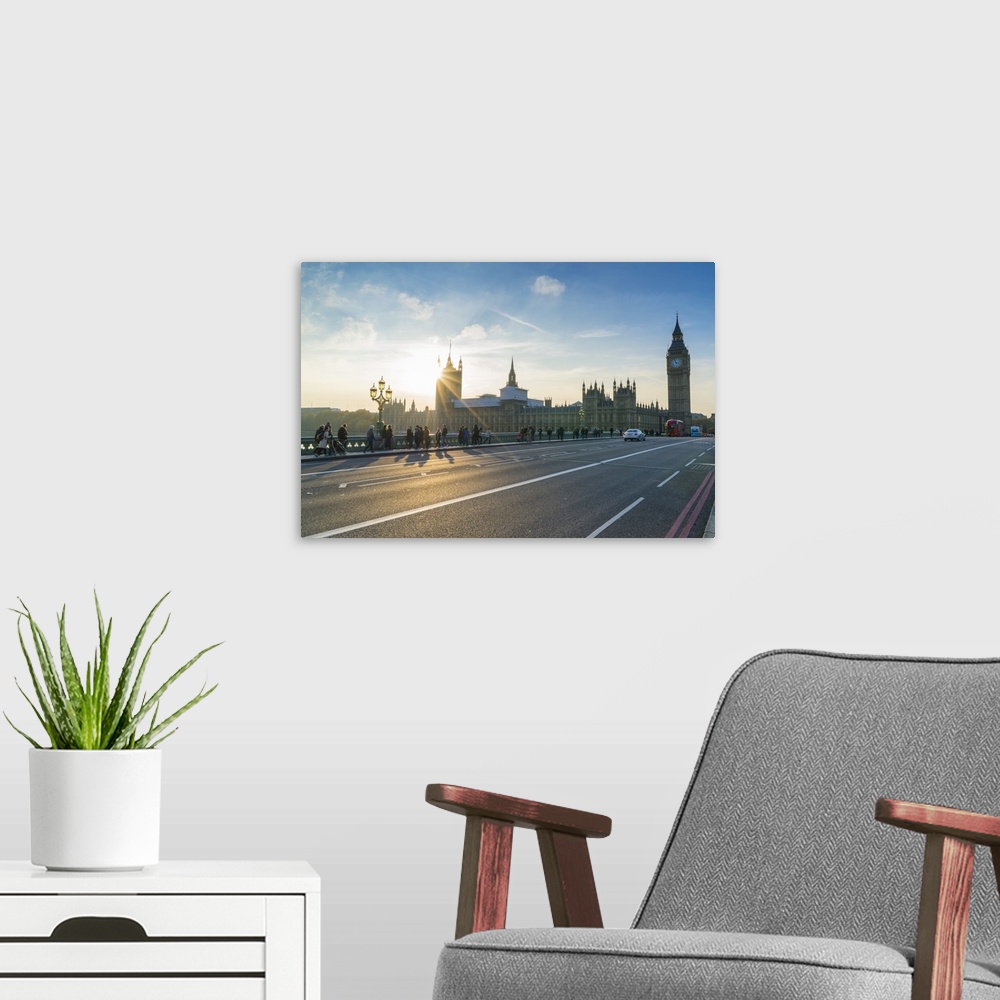 A modern room featuring Pedestrians on Westminster Bridge with Houses of Parliament and Big Ben at sunset, London, Englan...