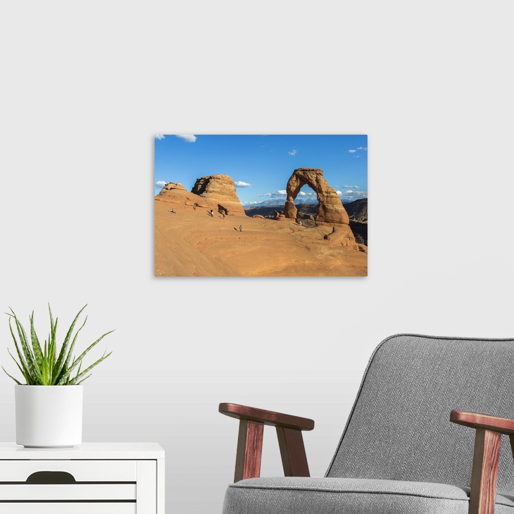 A modern room featuring Peoples at Delicate Arch at golden hour, Arches National Park, Moab, Grand County, Utah
