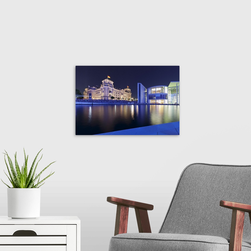 A modern room featuring Lightshow about German history, Reichstag Parliament Building and Paul Loebe Haus Building, Berli...