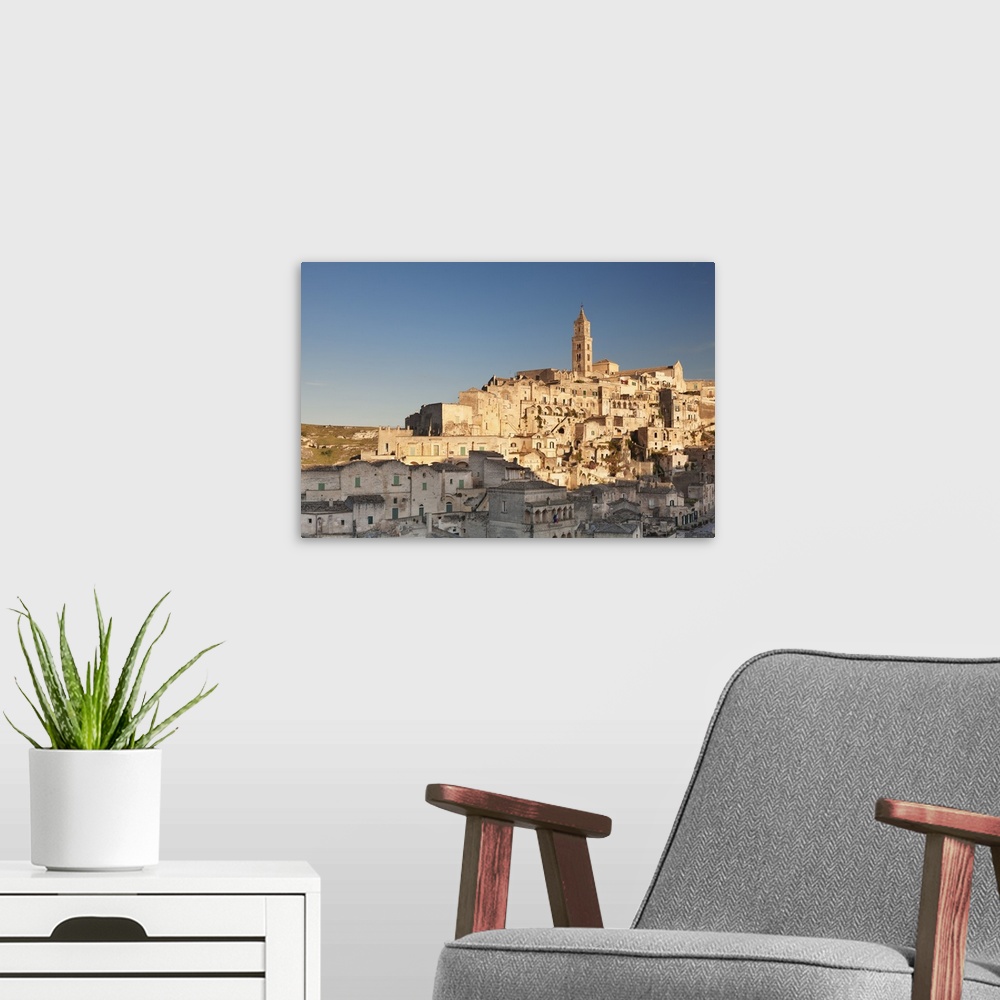 A modern room featuring Sasso Barisano and cathedral at sunset, UNESCO World Heritage Site, Matera, Basilicata, Puglia, I...