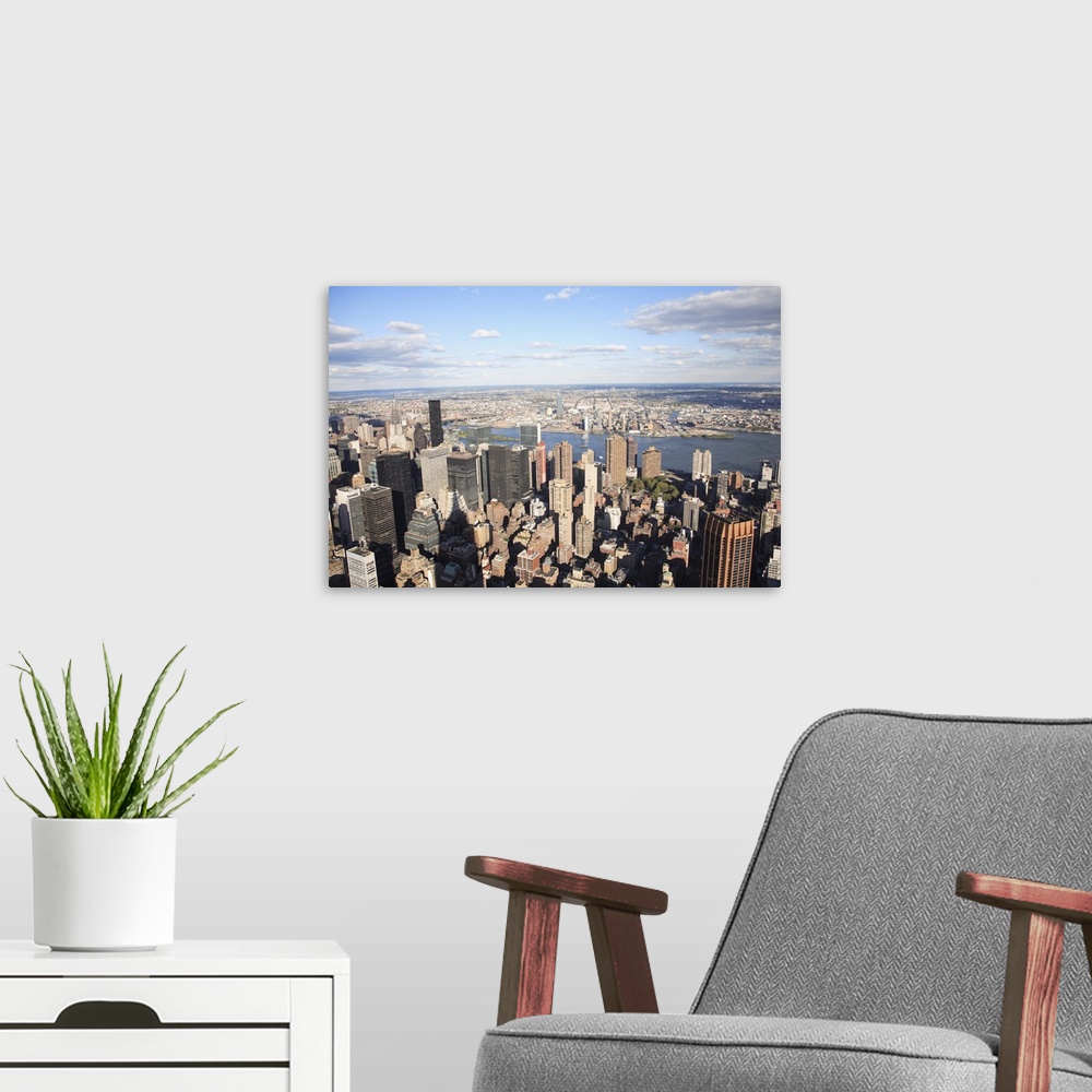 A modern room featuring Shadow of Empire State Building, Manhattan, East River, Queens, New York City