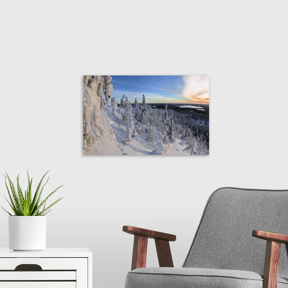 A modern room featuring Panorama of snowy landscape and woods framed by blue sky and sun, Ruka, Kuusamo, Ostrobothnia reg...