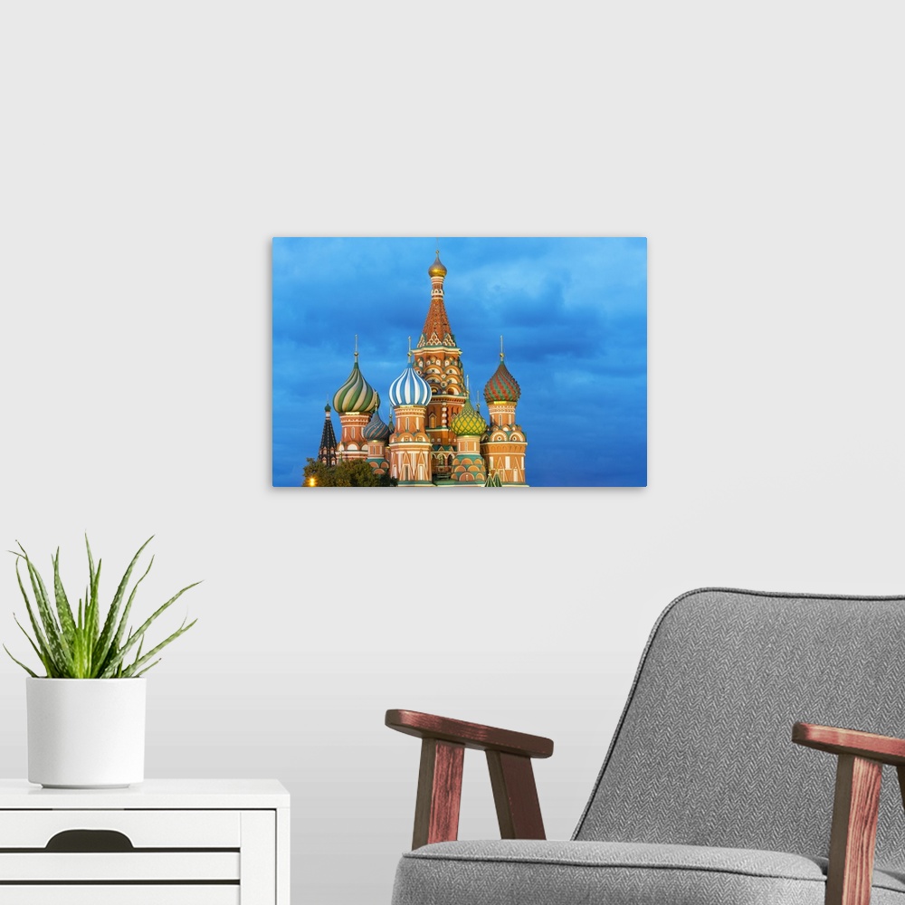 A modern room featuring St. Basil's Cathedral lit up at night, Moscow, Russia