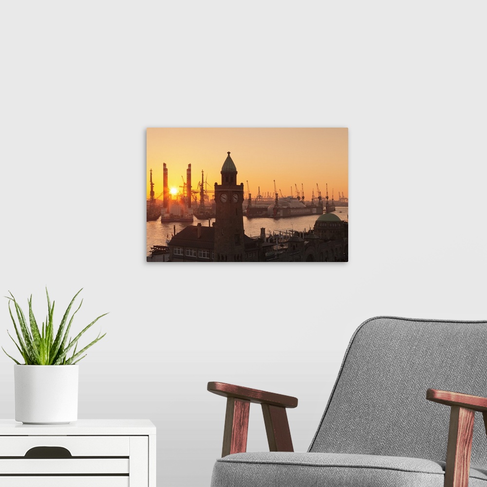 A modern room featuring St. Pauli Landungsbruecken pier against harbour at sunset, Hamburg, Hanseatic City, Germany
