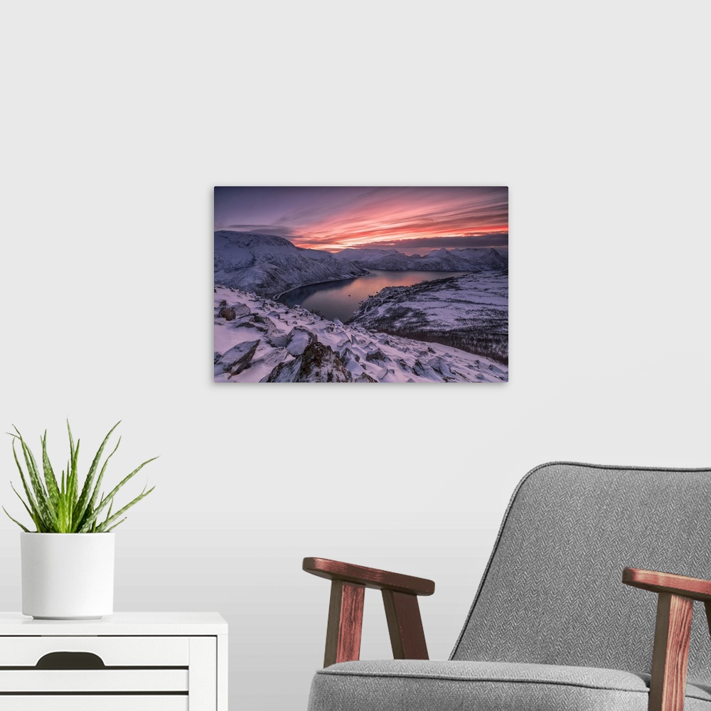 A modern room featuring The frozen sea surrounded by snow framed by pink clouds, Arctic, Norway, Scandinavia, Europe