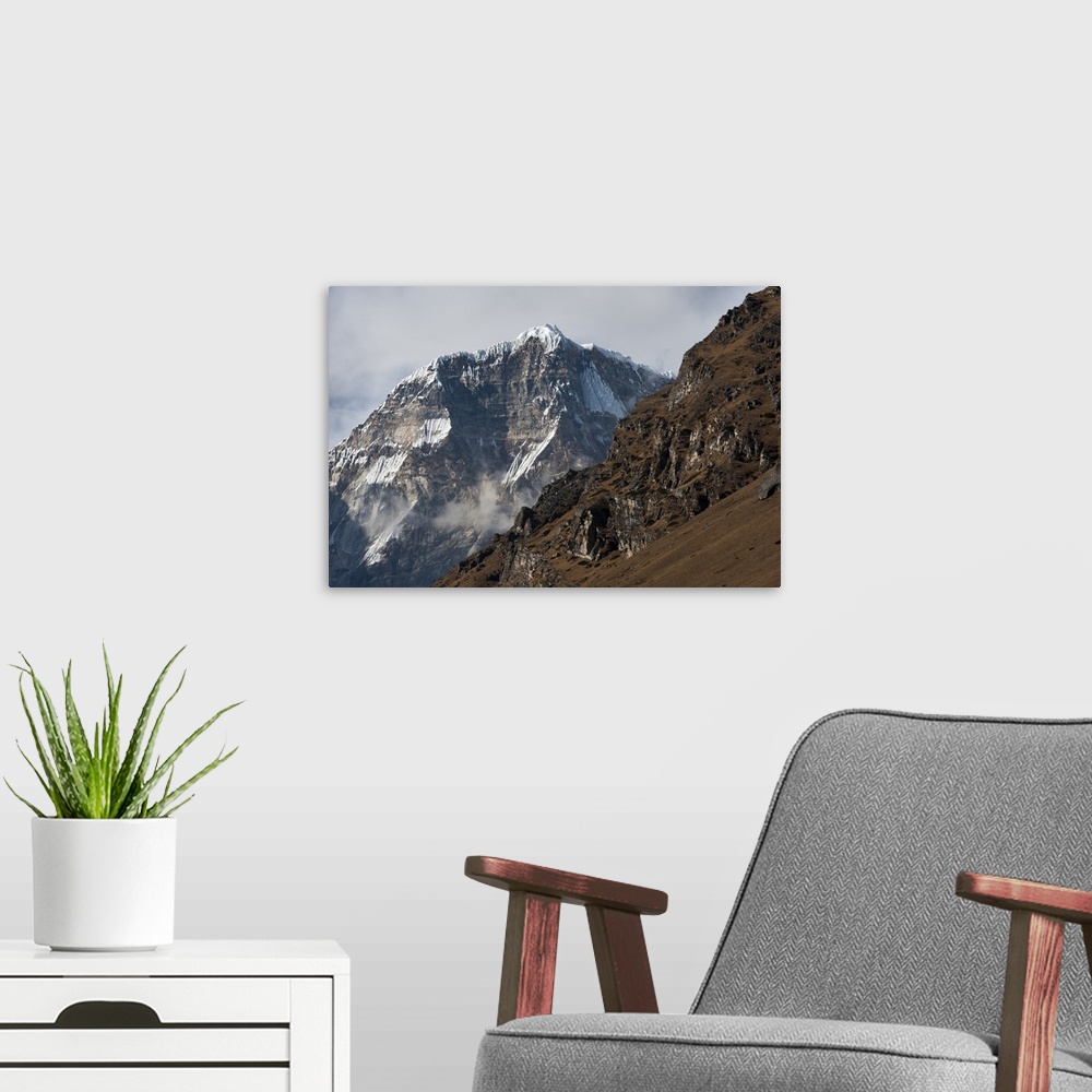 A modern room featuring The looming face of Jomolhari, the third highest mountain in Bhutan at 7326m, seen from Jangothan...