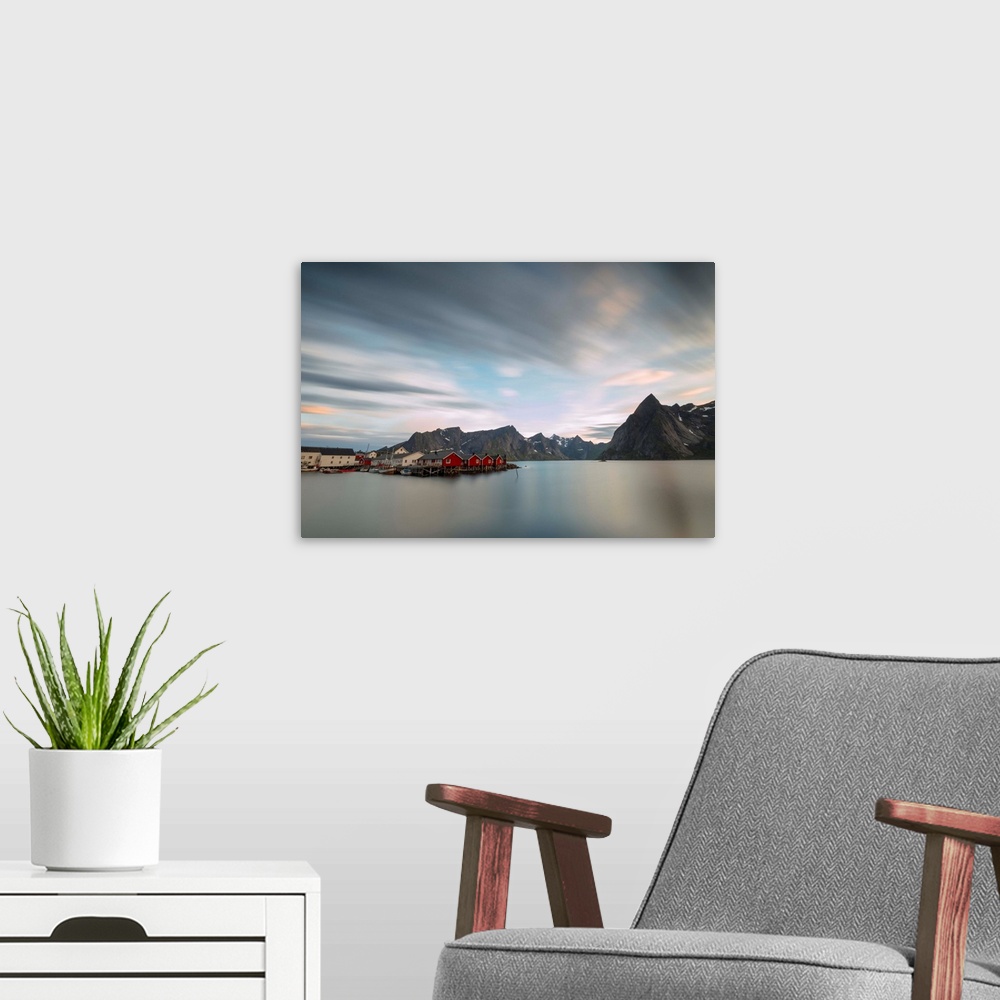 A modern room featuring The summer sunset at night on fishing village and cold sea, Hamnoy, Moskenesoya, Nordland county,...
