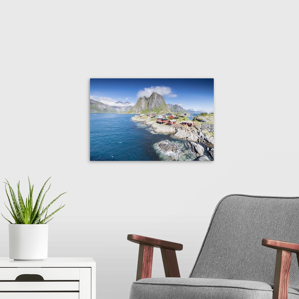A modern room featuring Top view of the fishing village framed by blue sea and high peaks Hamnoy, Moskenesoya, Nordland c...