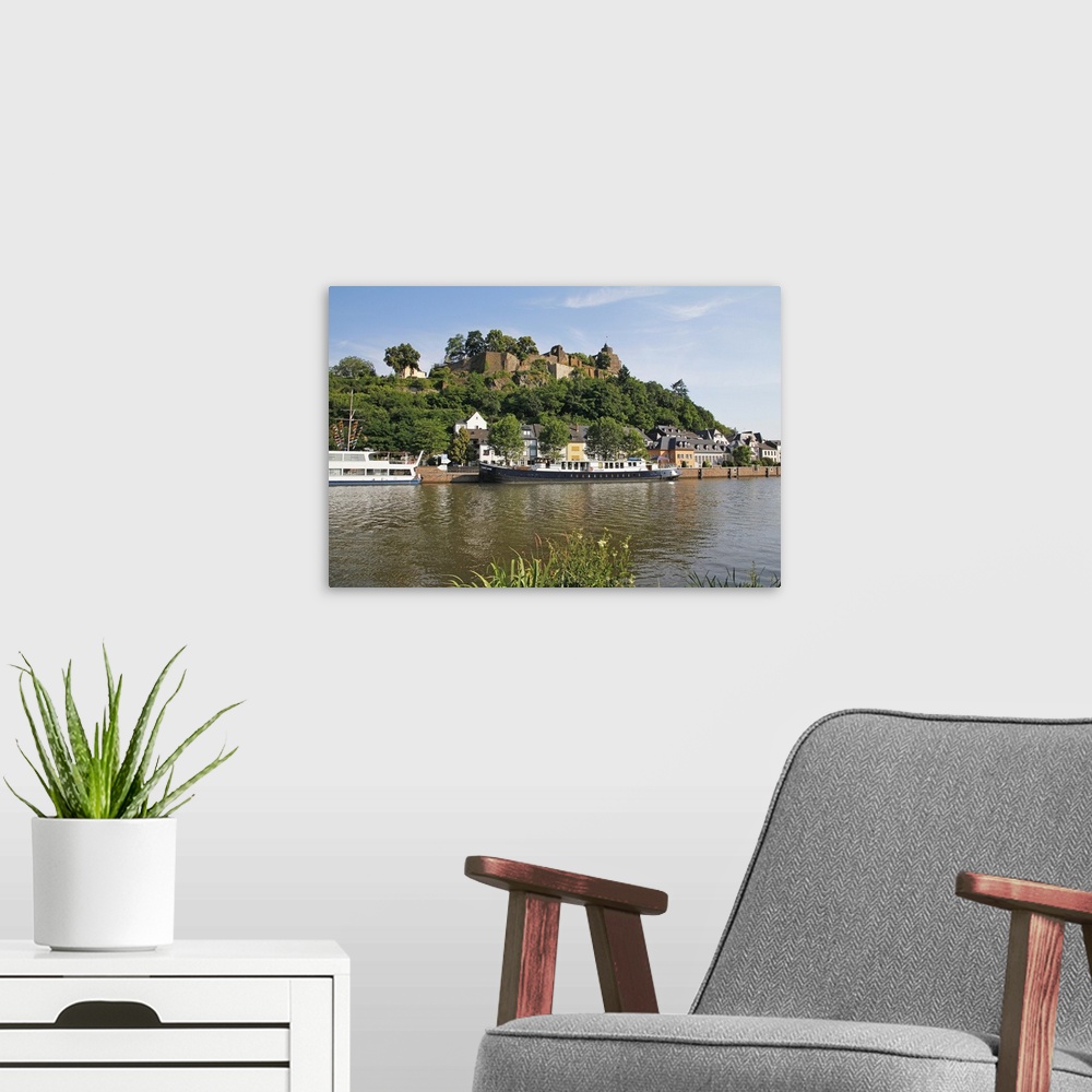 A modern room featuring Tour Boats with Castle Ruin in Saarburg on Saar River, Rhineland-Palatinate, Germany