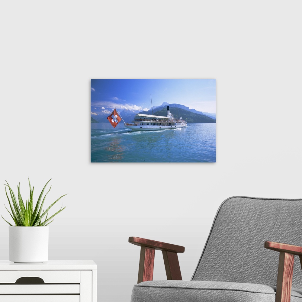A modern room featuring Tourist boat crossing the lake, Lake Geneva (Lac Leman), Switzerland