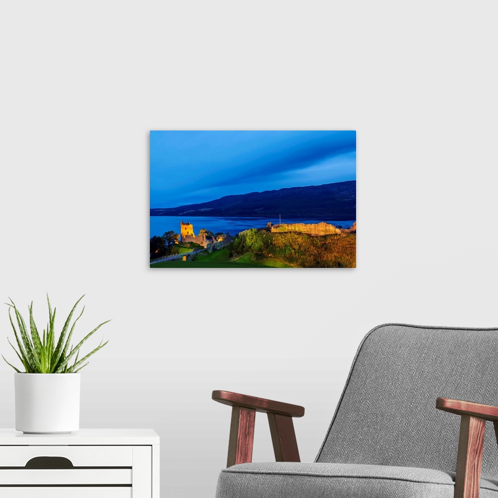A modern room featuring Twilight view of Urquhart Castle and Loch Ness, Highlands, Scotland, United Kingdom, Europe