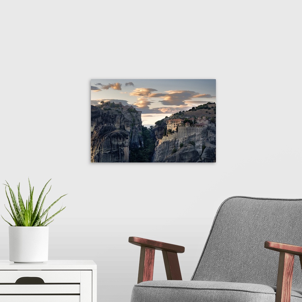 A modern room featuring Sunset light on clouds and Varlaam and Megalo Meteoro Monasteries, Meteora, UNESCO World Heritage...