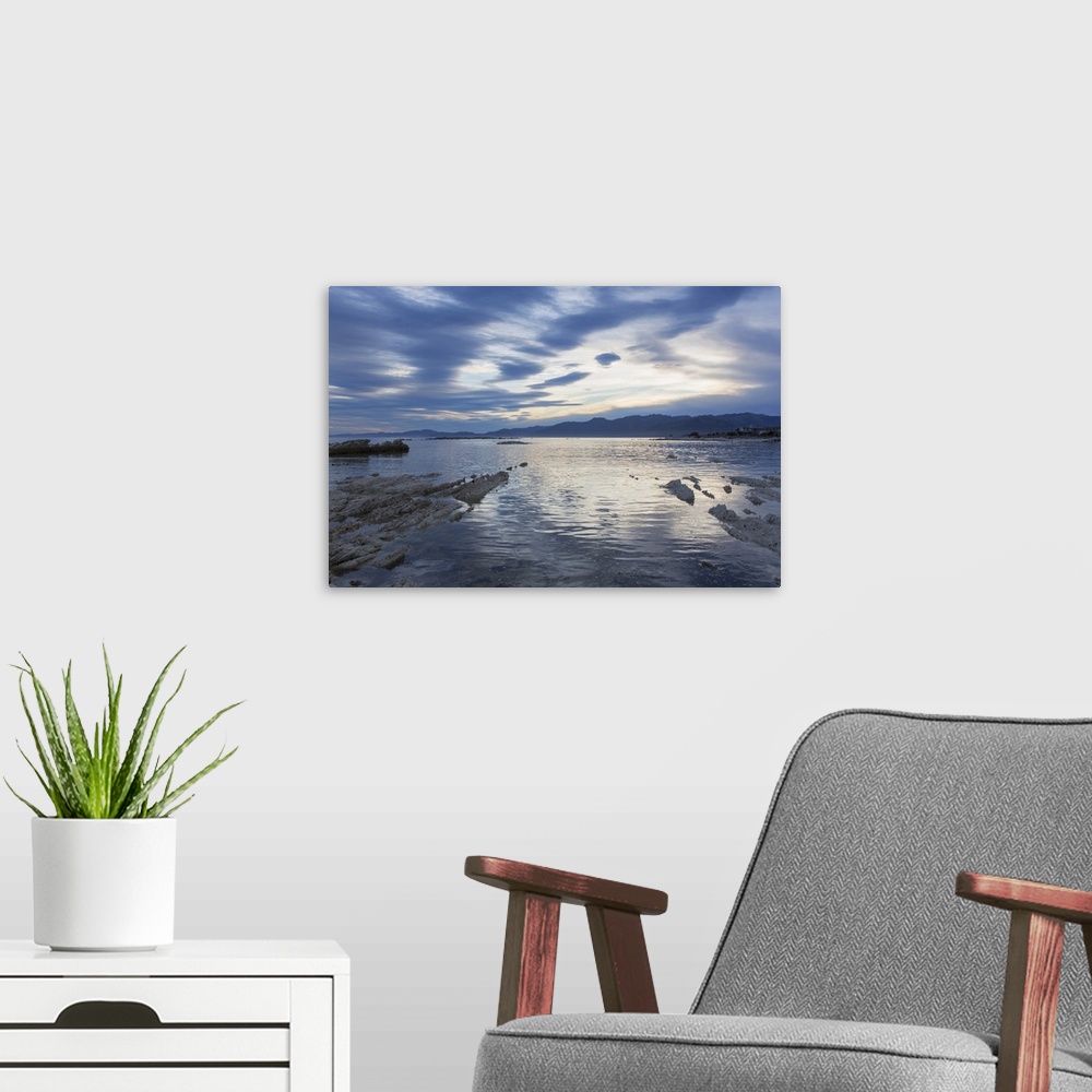 A modern room featuring View across the tranquil waters of South Bay at dusk, Kaikoura, Canterbury, South Island, New Zea...