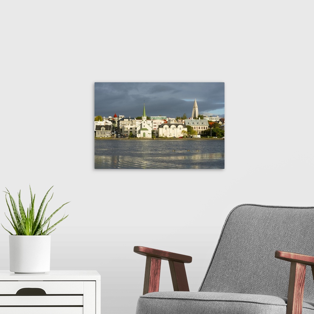 A modern room featuring View of the Historic Centre and Lake Tjornin, Reykjavik, Iceland, Polar Regions