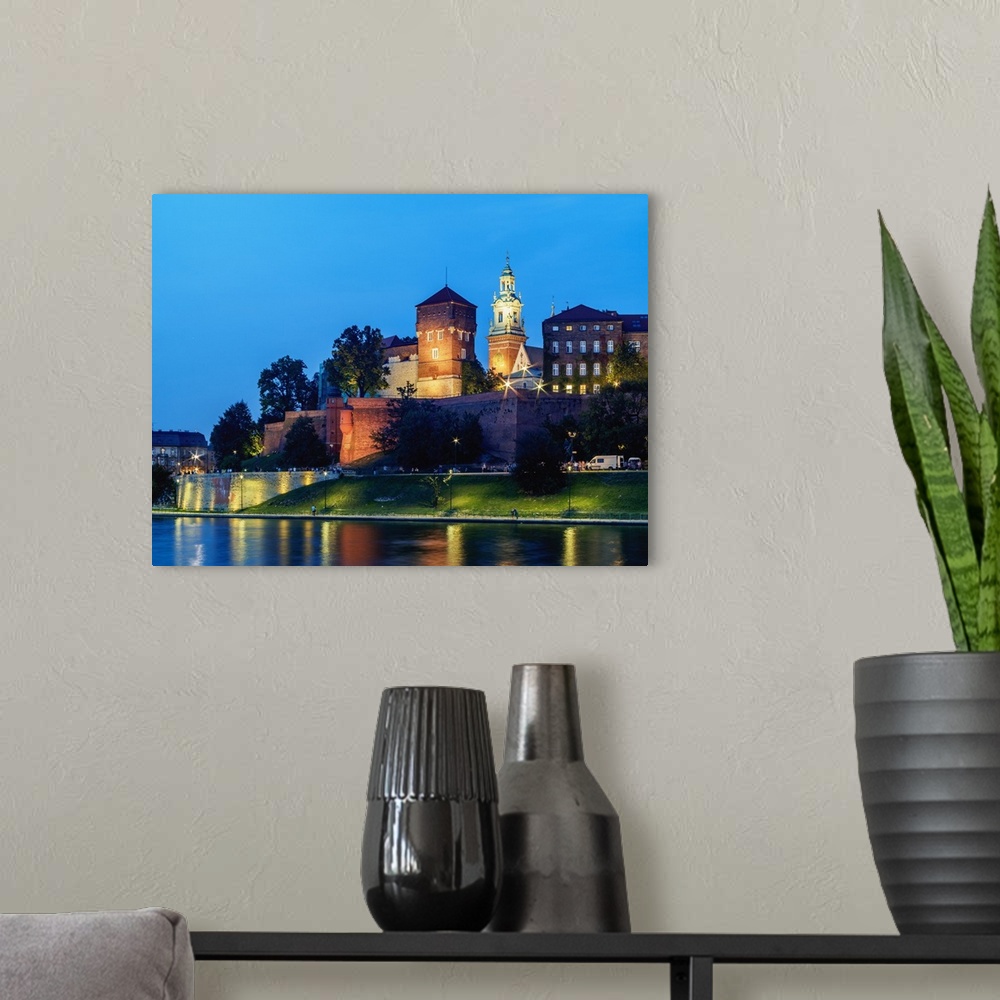 A modern room featuring Wawel Royal Castle and Vistula River at twilight, Cracow, Lesser Poland Voivodeship, Poland