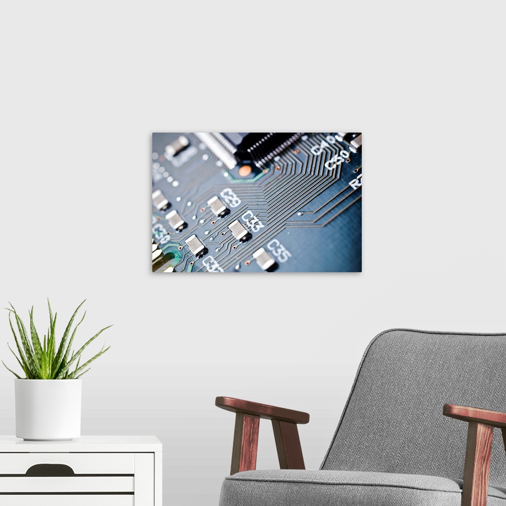 A modern room featuring Printed circuit board components. Electronic components soldered into a printed circuit board (PC...