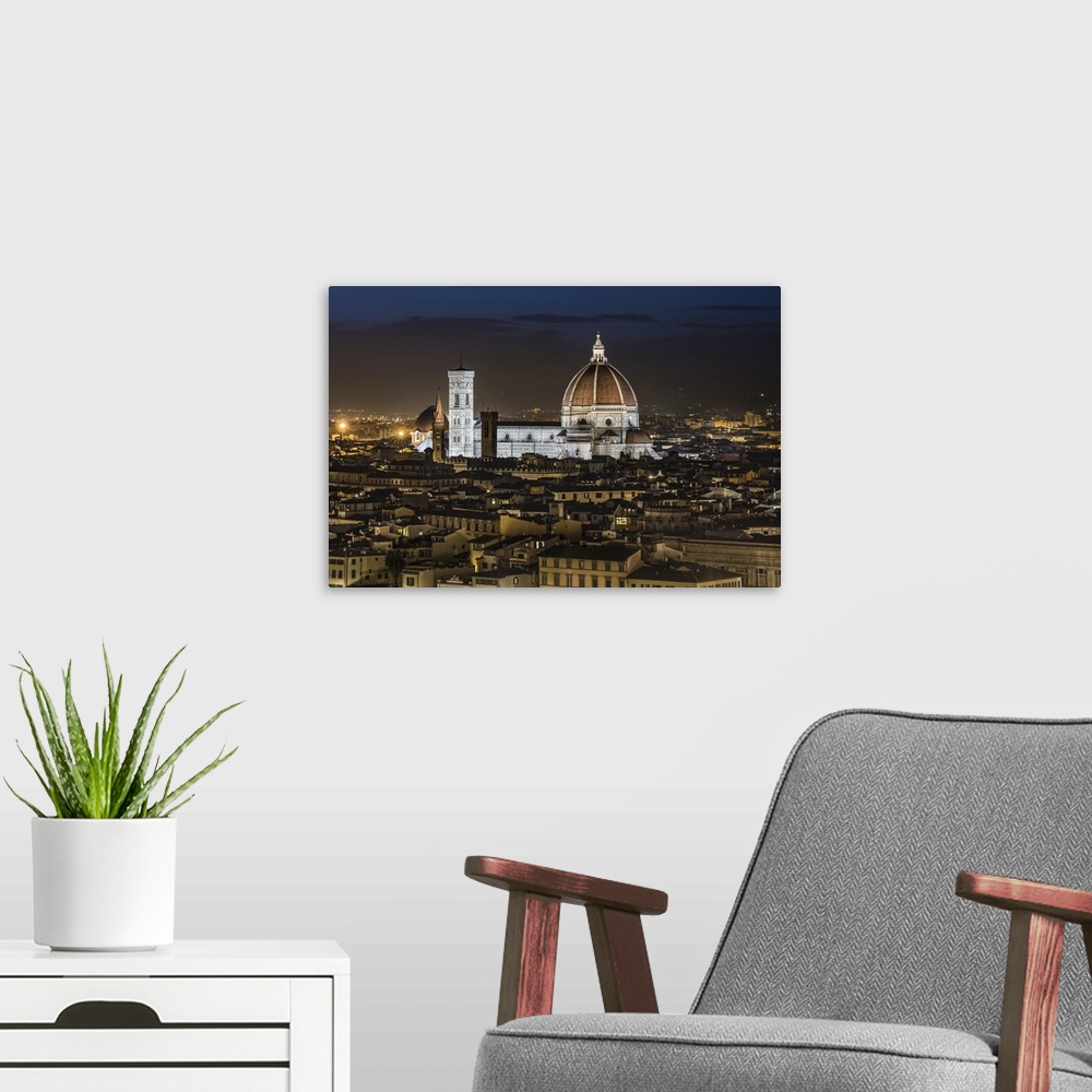 A modern room featuring The Duomo after dark in Florence, Italy