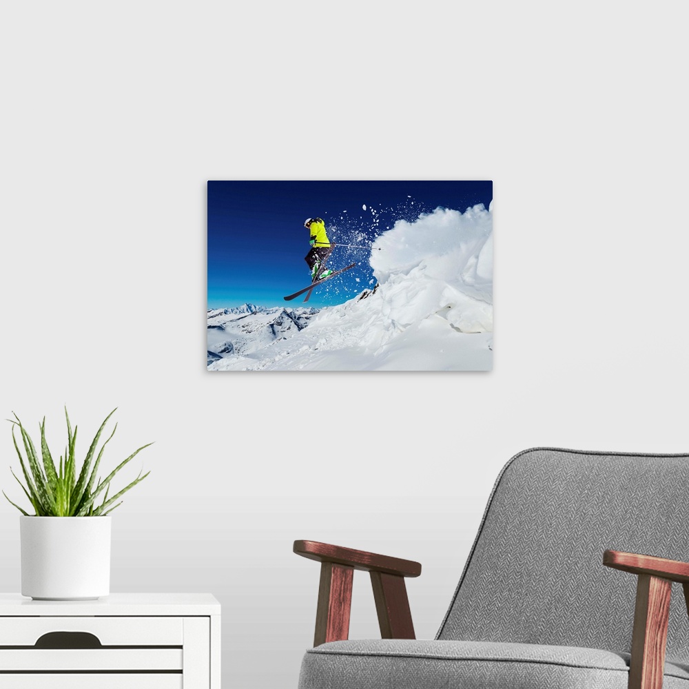 A modern room featuring Alpine skier skiing downhill, blue sky in background.