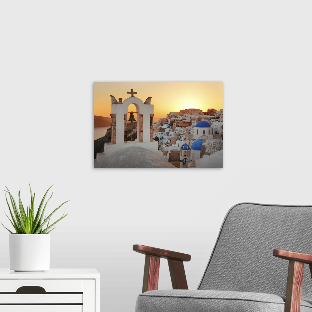 A modern room featuring Santorini Skyline Sunset With Church Bell And Buildings In Greece