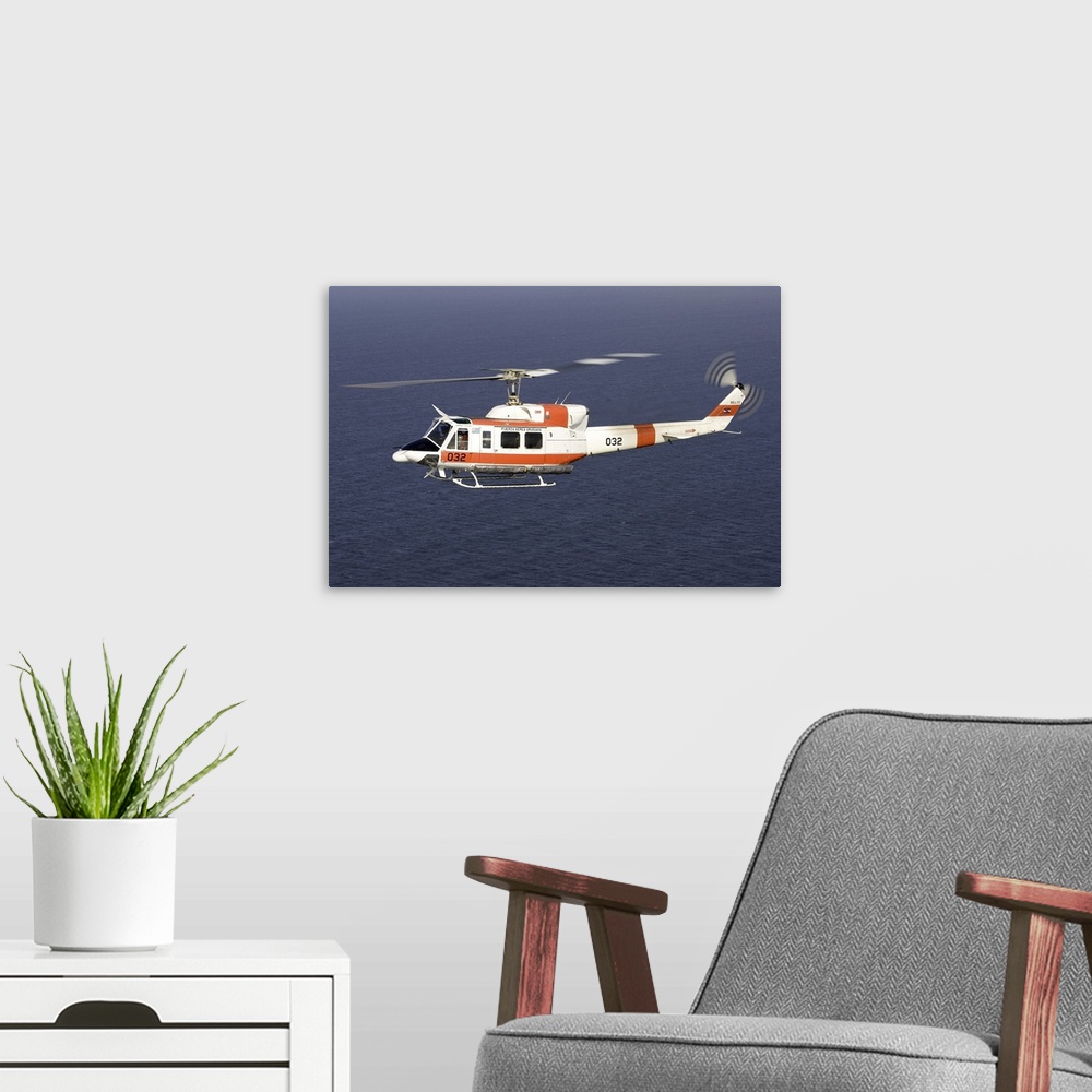 A modern room featuring A Bell 212 helicopter of the Uruguayan Air Force off the coast of Montevideo, Uruguay.