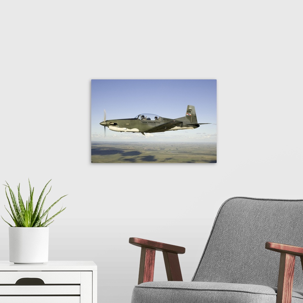 A modern room featuring A PC-7U, locally referred to as AT-92, of the Uruguayan Air Force.