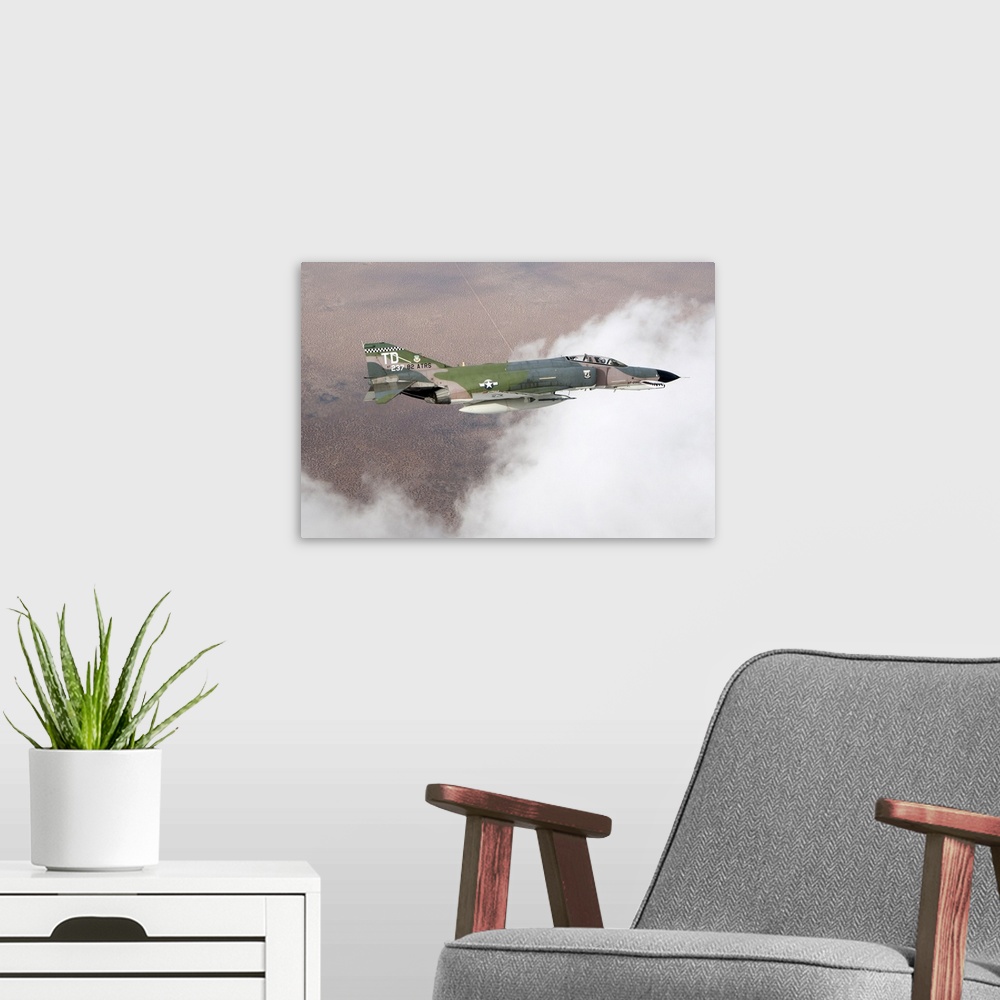 A modern room featuring A QF-4E Phantom flying over the White Sands Missile Range in New Mexico.