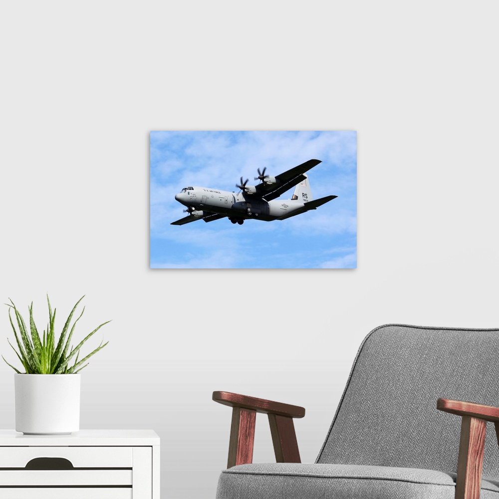 A modern room featuring A U.S. Air Force C-130J-30 Hercules transport aircraft.