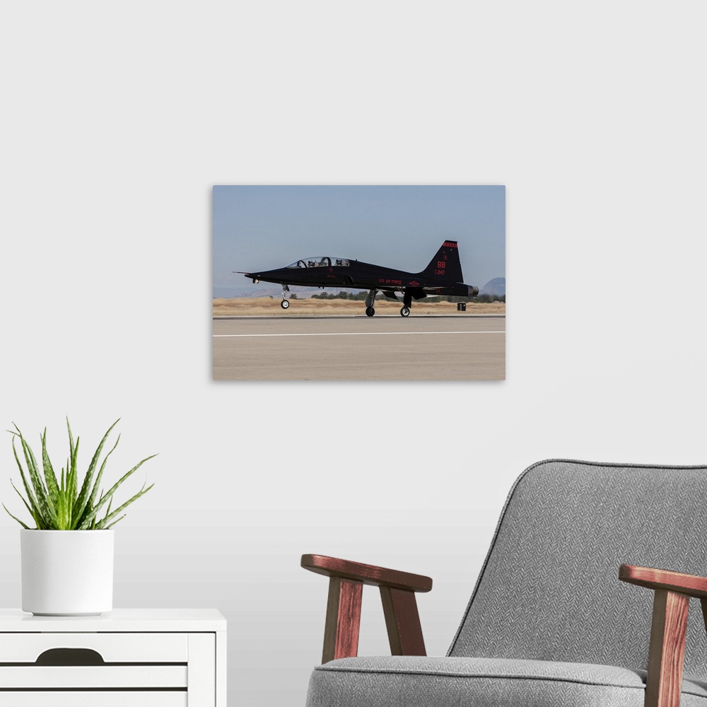 A modern room featuring A U.S. Air Force T-38A taking off from Beale Air Force Base, California.