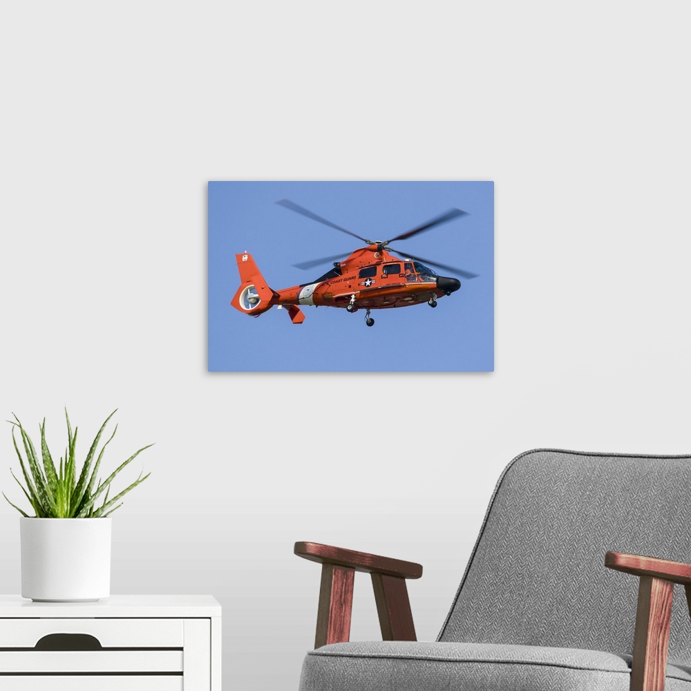 A modern room featuring A U.S. Coast Guard MH-65 Dolphin on approach to Boeing Field, Seattle, Washington.
