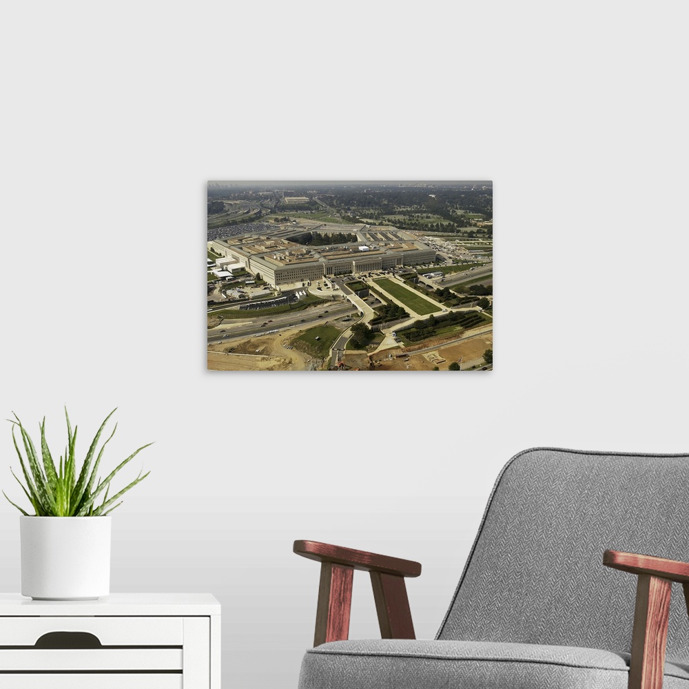 A modern room featuring Aerial photograph of the Pentagon with the River Parade Field in Arlington, Virginia.