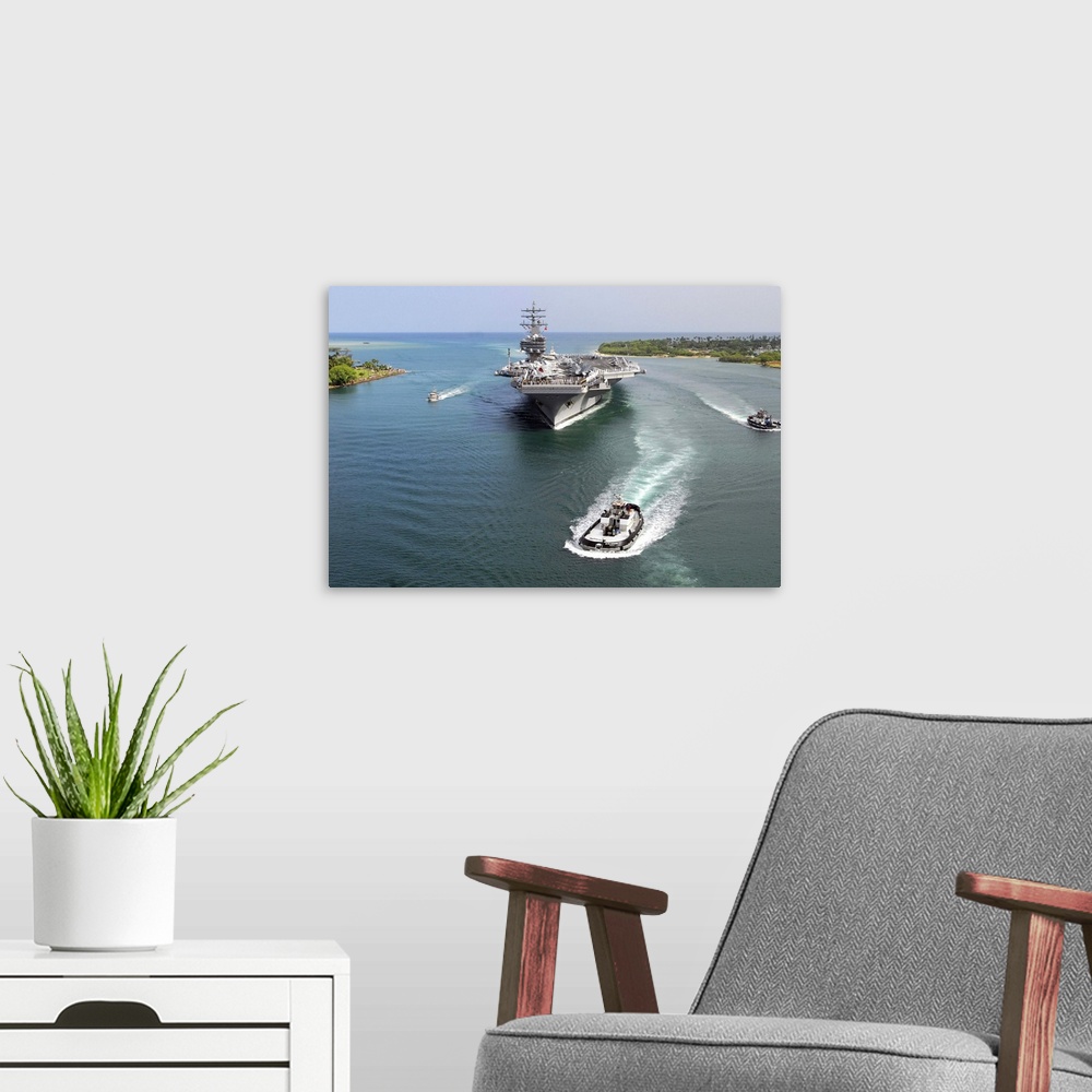 A modern room featuring Aircraft carrier USS Ronald Reagan transits Pearl Harbor into Hawaii.