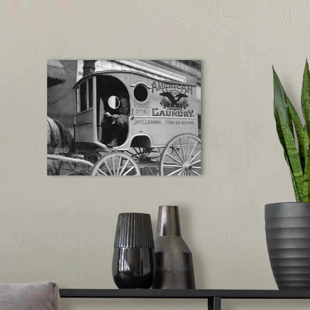 A modern room featuring American history photograph of a young wagon delivery boy, Birmingham, Alabama, 1914.
