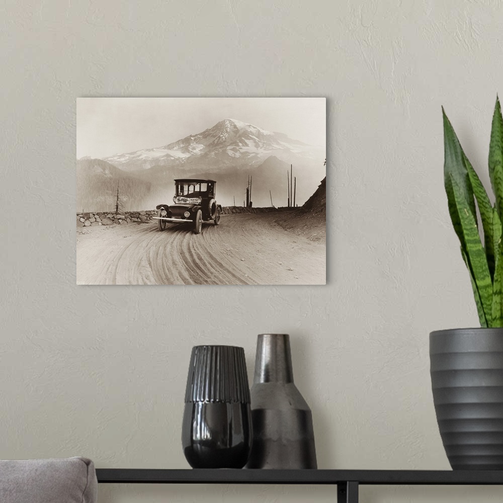 A modern room featuring An electric car produced for on a promotional tour, with Mt. Rainier in the distance.