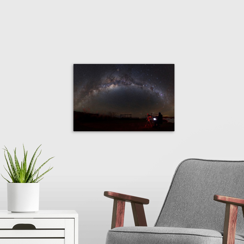 A modern room featuring Astronomer with telescope looking at the Milky Way in the Atacama Desert, Chile.