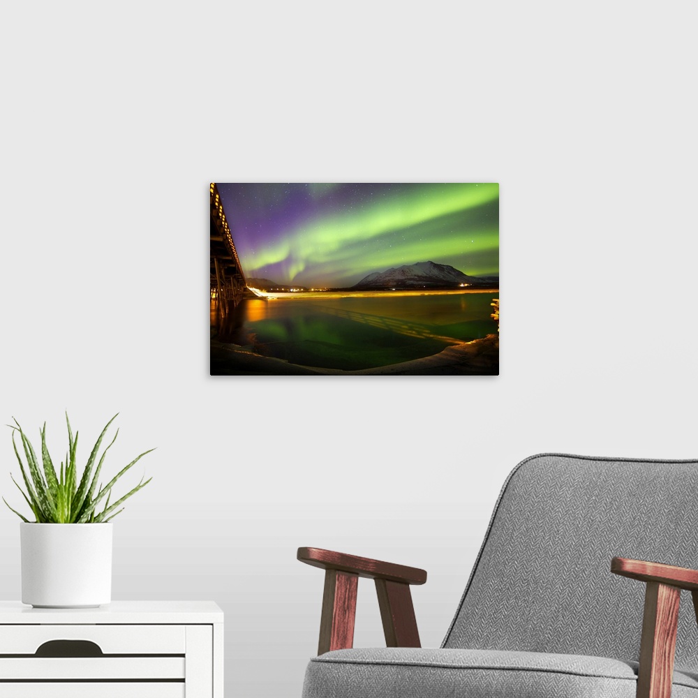 A modern room featuring Aurora borealis over Nares Lake, Carcross, Yukon, Canada.
