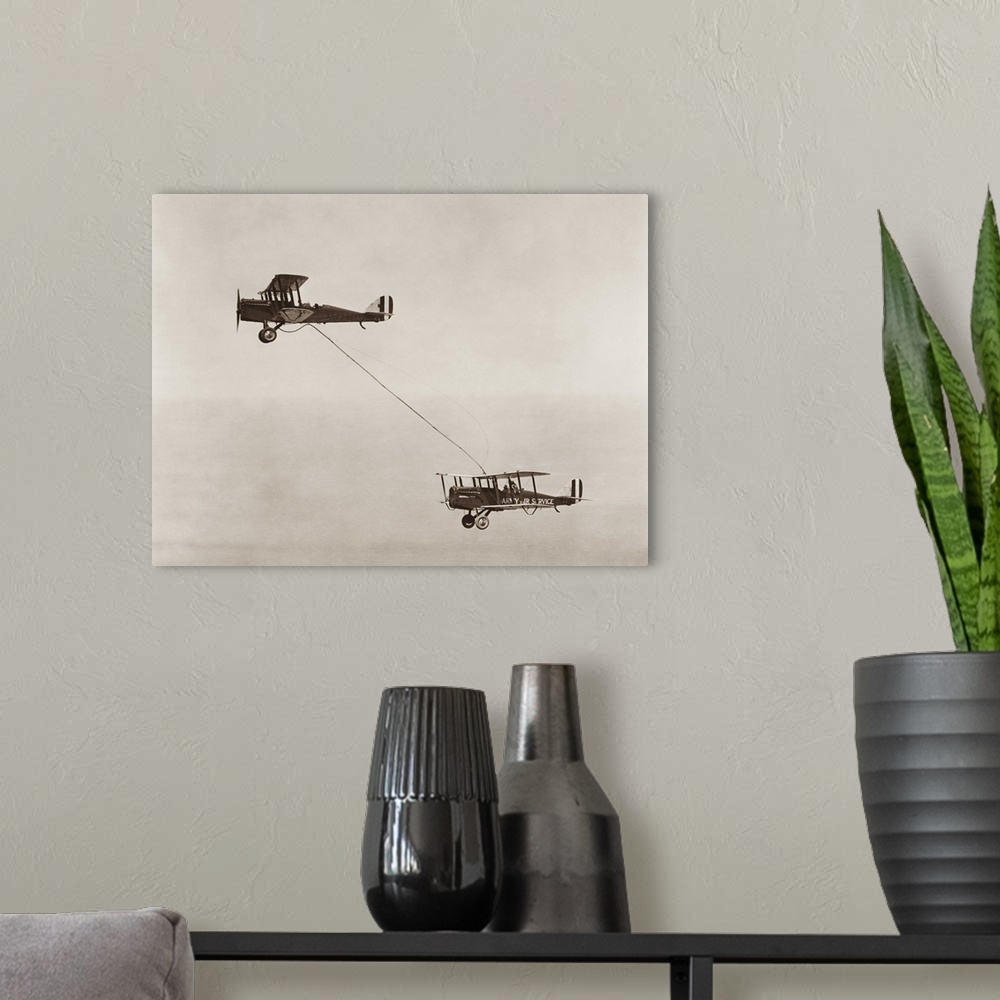 A modern room featuring Bi-planes of the United States Army Air Service performing the first public aerial refueling.