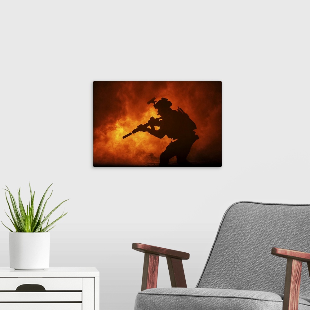A modern room featuring Black silhouette of soldier in the burning fire during a battle operation.