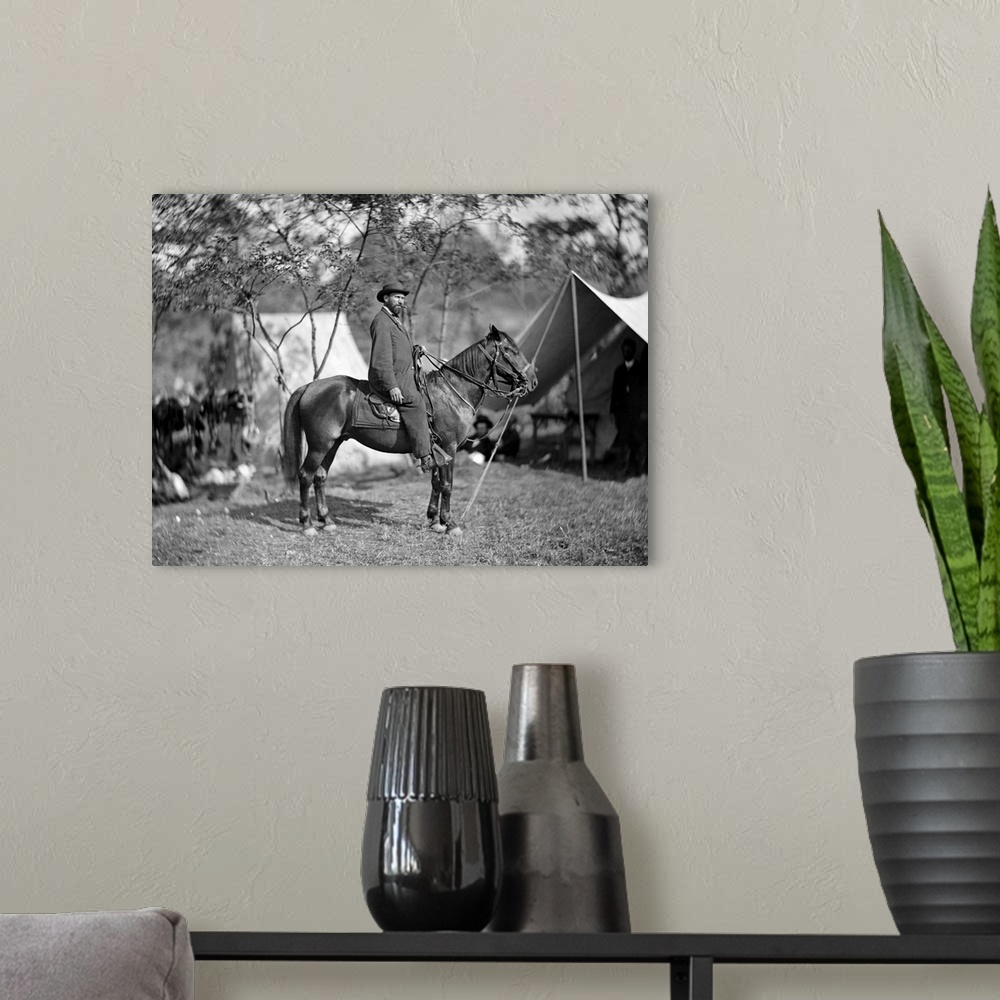 A modern room featuring Civil War photo of Allan Pinkerton seated on a horse during teh Battle of Antietam.