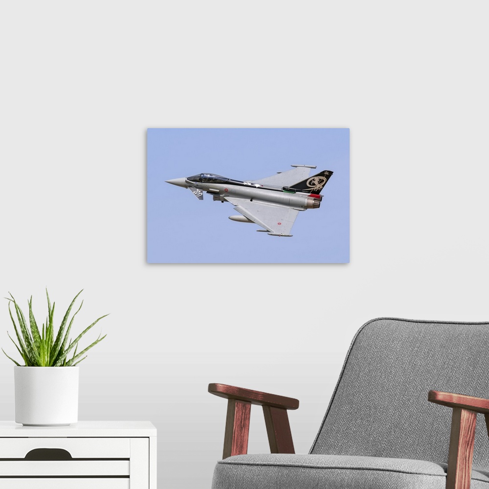 A modern room featuring Italian Air Force F-2000A Typhoon taking off.