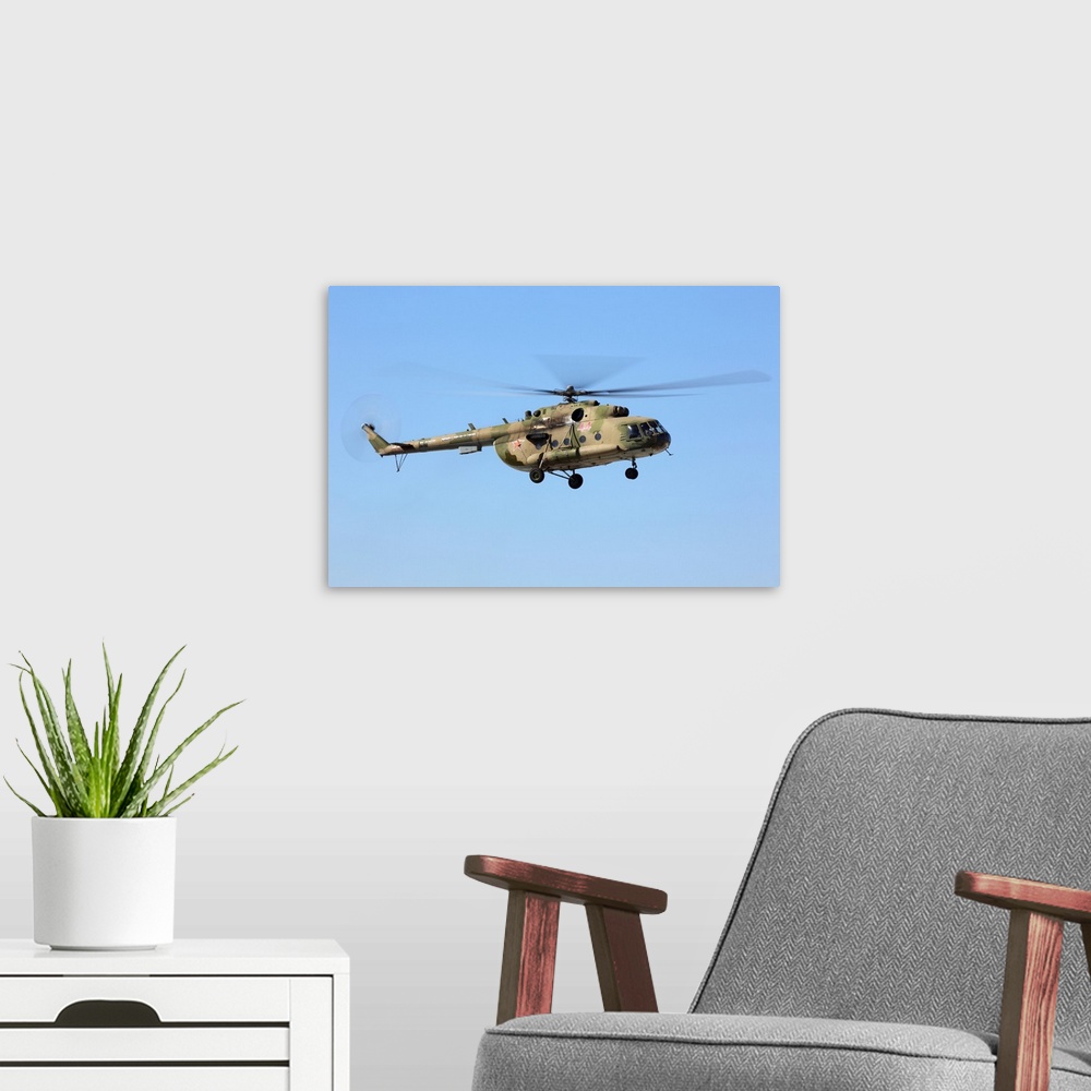 A modern room featuring Mil Mi-8MT transport helicopter of Russian Air Force landing.