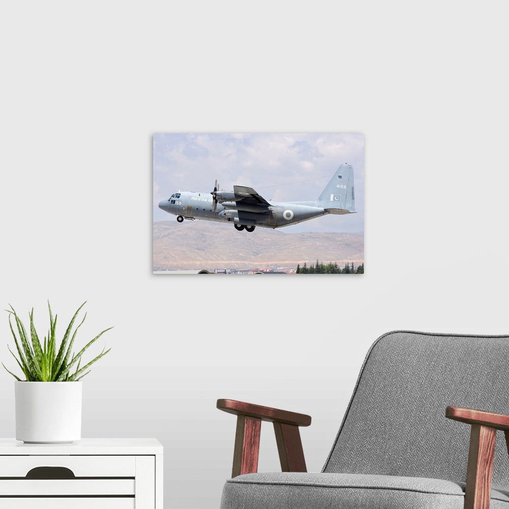 A modern room featuring Pakistan Air Force C-130 Hercules taking off from Konya Air Base, Turkey.