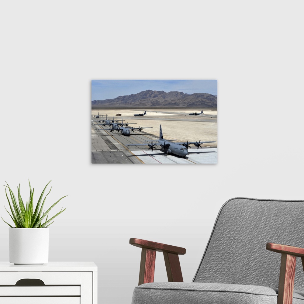 A modern room featuring June 21, 2014 - Seven C-130J Super Hercules taxi after landing during the Joint Forcible Entry ex...