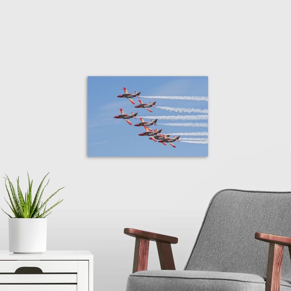 A modern room featuring Spanish aerobatic team Patrulla Aguila with their C-101EB planes, performing at the International...