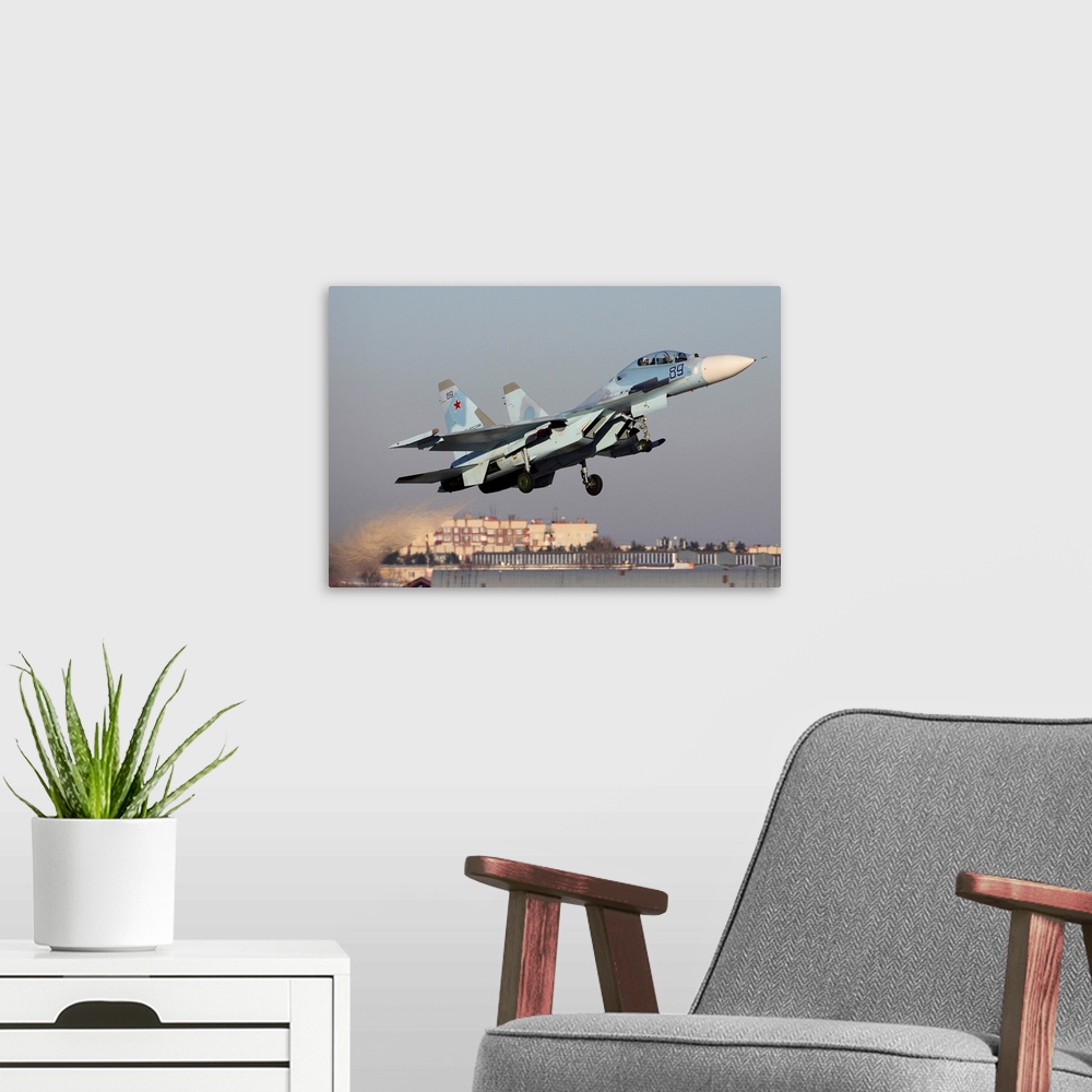 A modern room featuring Su-30M2 jet fighter of Russian Air Force taking off, Zhukovsky, Russia.