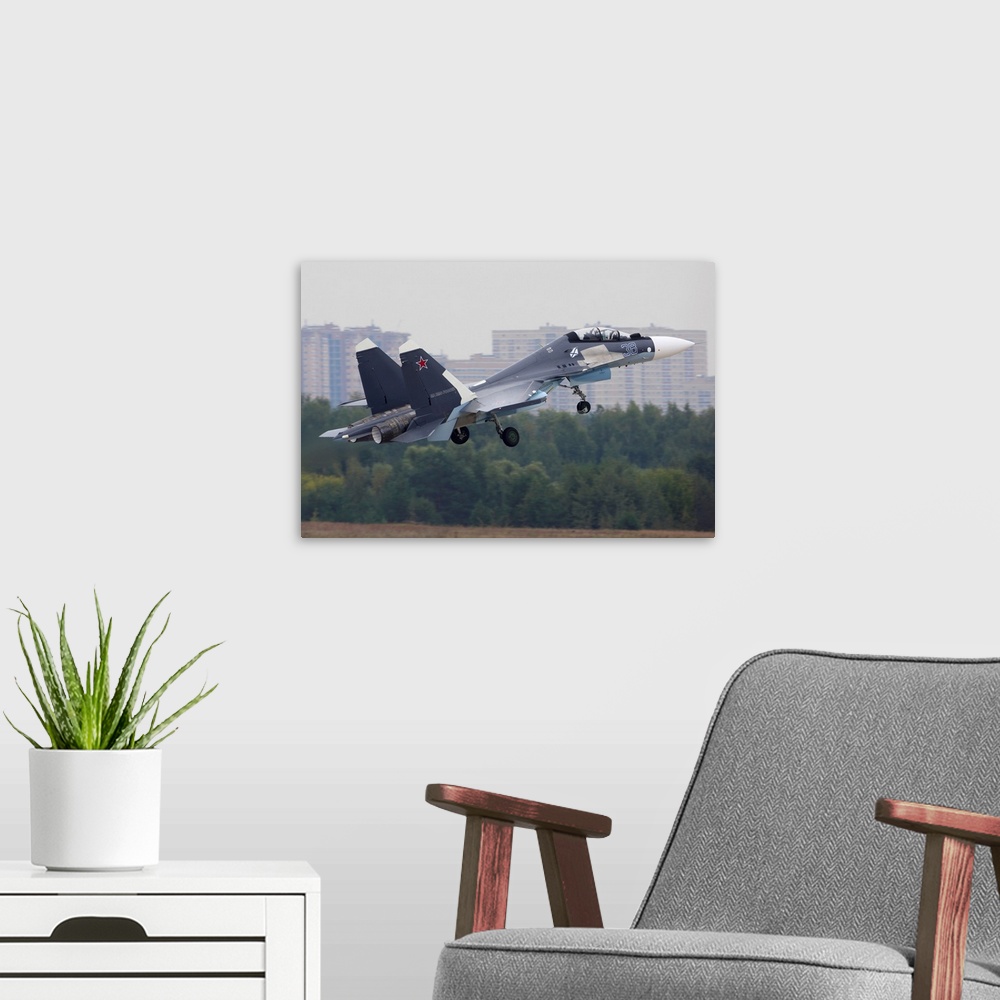 A modern room featuring Su-30SM jet fighter of Russian Navy taking off, Zhukovsky, Russia.