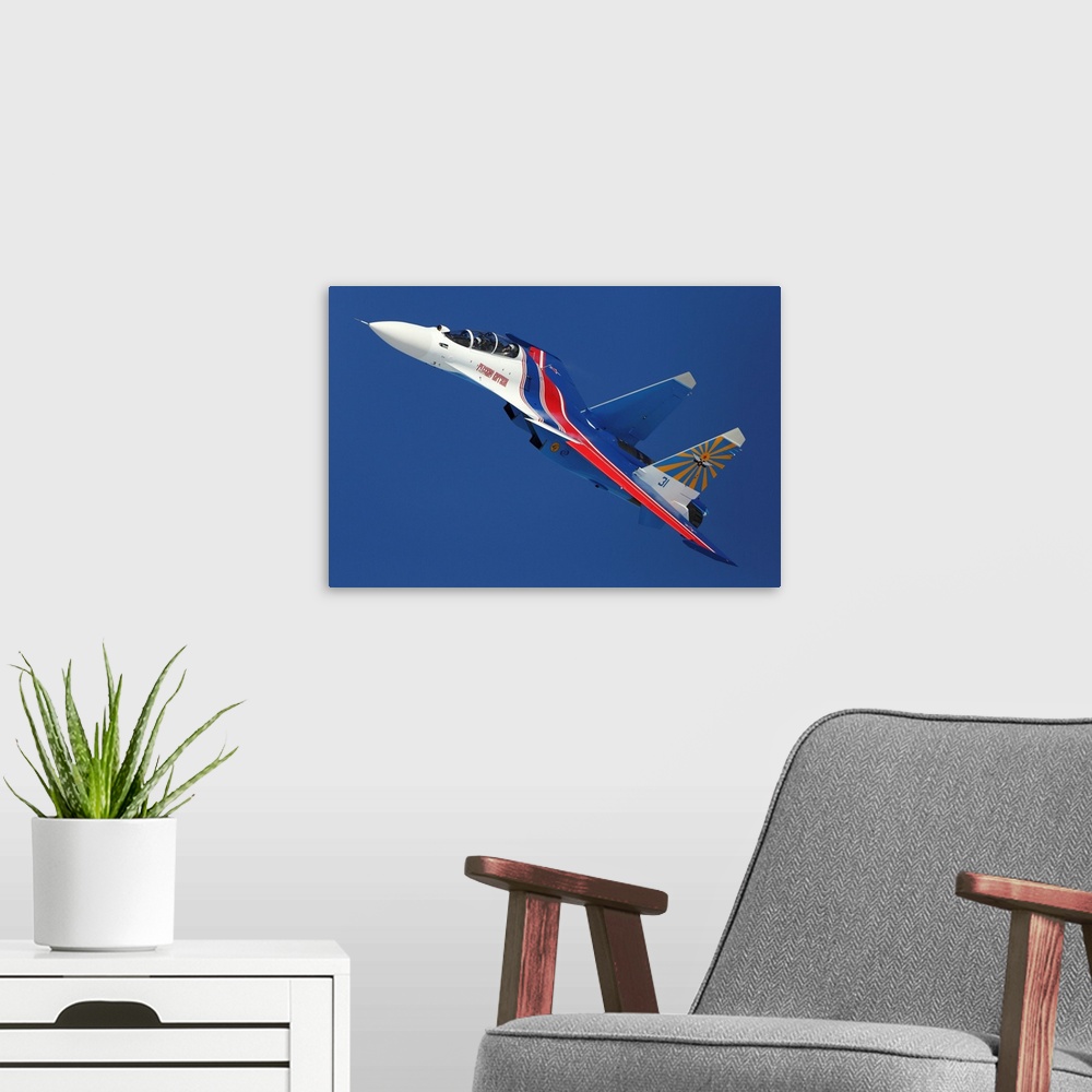 A modern room featuring Su-30SM jet fighter of the Russian Knights aerobatic team.